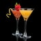 Two cocktails red cosmopolitan cocktail decorated with citrus le