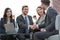 Two colleagues handshaking after meeting.