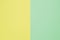 Two-color paper background. The background is yellow and delicate mint color, divided vertically equally