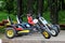 Two color wheeled bicycles in the park