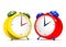 Two colorful alarm clocks on white background.