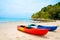 Two colorful canoe on sandy beach