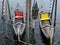 Two colorful gondolas docked in a lake