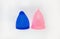 Two colorful, pink and blue sizes of menstural cups from medical high quality silicone, 20 and 30 ml capacity