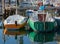 Two Colorful Sailboats Moored in a Marina