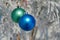 Two colour balls on a snow-covered tree