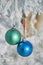 Two colour balls on a snow-covered tree