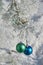 Two colour balls on a snow-covered tree