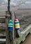 Two colourful buoys on a foggy morning