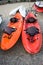 Two Colourful Dual Seater Sit on Top Sea Kayak Parked on Coarse Sand. Watersport Outdoor Adventure Ideas. Equipments fo