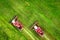 Two combine harvesters on green field. Agriculture concept. Harvest season. Combines harvesting on agricultural field