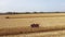 Two Combines harvesting corn aerial view.