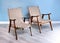 Two comfortable wooden easy chairs