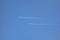 Two commercial jets flying high on clear sky