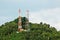 Two communication towers on a hill