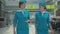 Two confident beautiful stewardesses walking in airport and talking. Portrait of charming smiling Caucasian women in