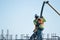 Two construction workers pour cement in rebar