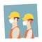 Two construction workers wearing masks