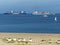 Two containerships Evergreen and Maersk in the estuary of the Scheldt river in Netherlands