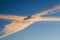 Two contrails crossing in the sky.
