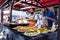 Two cooks selling fried fish food at the Bergen fishmarket, Norway