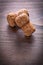 Two corks of champagne on vintage wooden boar with