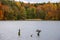 Two cormorants on wooden pilings