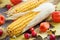 Two corns, hawthorn and dog rose berries. Autumn still life.