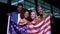Two couple of multiracial teenagers holding usa flag, country patriots, slow-mo