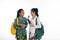 Two couple student talk together carrying bag and books in traditional clothes