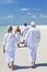 Two Couples Family Generations Walking on Beach