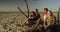 Two couples sitting at the beach relaxing