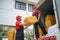 Two Couriers Handing Over Packages to Customers at Home