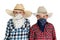 Two cowboy brothers wearing hats and bandanas looking at camera