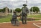 Two cowboys in a Cowboy camp, part of the longest bronze sculpture collection in the United States in The Center at Preston Ridge.