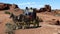 Two cowboys on a stagecoach in the frontier desert scene