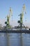 Two cranes working at the pier of the Kanonersky channel. The St. Petersburg cargo port