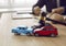 Two crashed toy automobiles on lawyer's table illustrating car insurance concept