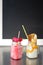 Two crazy milkshakes, with a blank blackboard