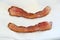 Two crispy pieces of tasty bacon for breakfast