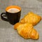 Two croissants ceramic mug with coffee