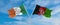 two crossed flags Afghanistan and Ireland waving in wind at cloudy sky. Concept of relationship, dialog, travelling between two