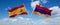 two crossed flags Armenia and spain waving in wind at cloudy sky. Concept of relationship, dialog, travelling between two