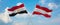 two crossed flags Austria and Egypt waving in wind at cloudy sky. Concept of relationship, dialog, travelling between two