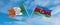 two crossed flags Azerbaijan and Ireland waving in wind at cloudy sky. Concept of relationship, dialog, travelling between two