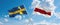 two crossed flags Belarus and Sweden waving in wind at cloudy sky. Concept of relationship, dialog, travelling between two