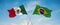 two crossed flags Brazil and mexico waving in wind at cloudy sky. Concept of relationship, dialog, travelling between two