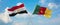 two crossed flags Cameroon and Egypt waving in wind at cloudy sky. Concept of relationship, dialog, travelling between two