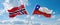 two crossed flags Chile and Norway waving in wind at cloudy sky. Concept of relationship, dialog, travelling between two countries