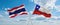 two crossed flags Chile and Thailand waving in wind at cloudy sky. Concept of relationship, dialog, travelling between two